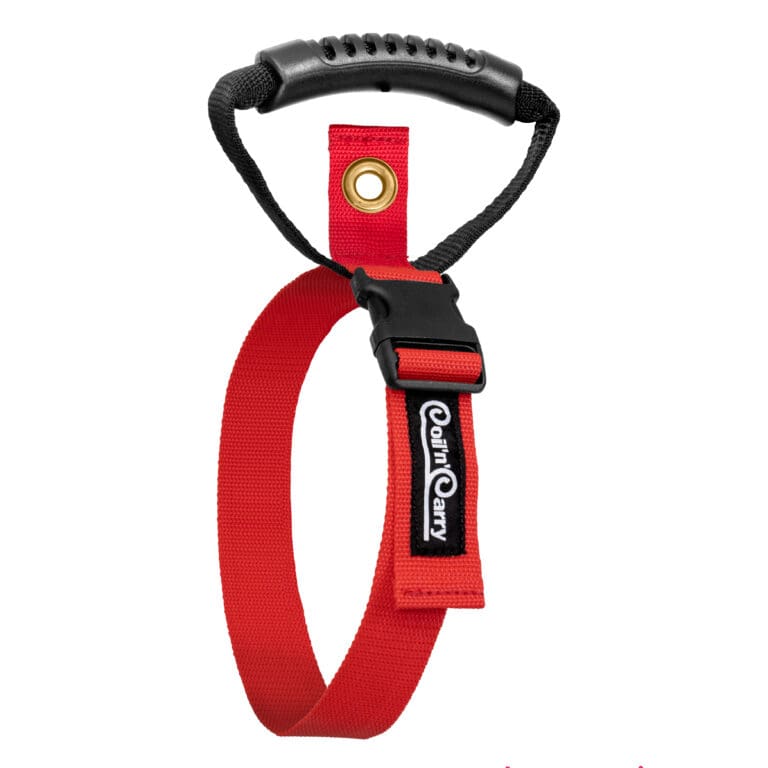 The Coil'n'Carry® Strap is a red nylon dog leash featuring a black plastic handle, black buckle, gold metal grommet, and the Court Carry logo on the strap.