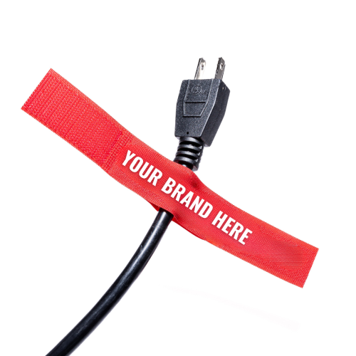 A black power cord with a red cable tie labeled YOUR BRAND HERE wrapped around it isolated on a white background TFI Custom Fabrication A black power cord with a red cable tie labeled YOUR BRAND HERE wrapped around it isolated on a white background
