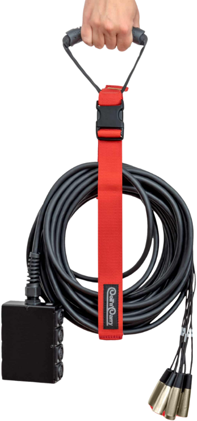 A hand holds a coiled black audio snake cable with multiple connectors secured by a red strap with a handle and a black buckle TFI Custom Fabrication A hand holds a coiled black audio snake cable with multiple connectors secured by a red strap with a handle and a black buckle