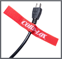 A black power cord secured with a red Velcro strap labeled CORD LOX against a white background