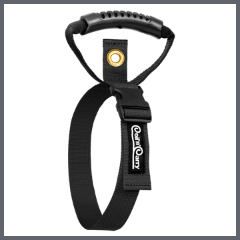 A black nylon surfboard leash string with a loop buckle padded handle and a gold metal grommet featuring the Creatures of Leisure logo on the strap shown against a light gray background