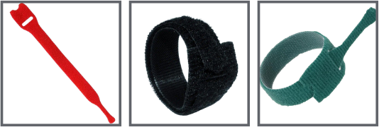 Three types of hook and loop cable ties a flat red strip a black looped strap with a fastening end and a green looped strap with a pull tab