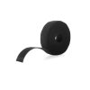 A VELCRO® Brand Fire Retardant Roll, 25 yards long, in black, with one end partially unrolled, isolated on a white background.