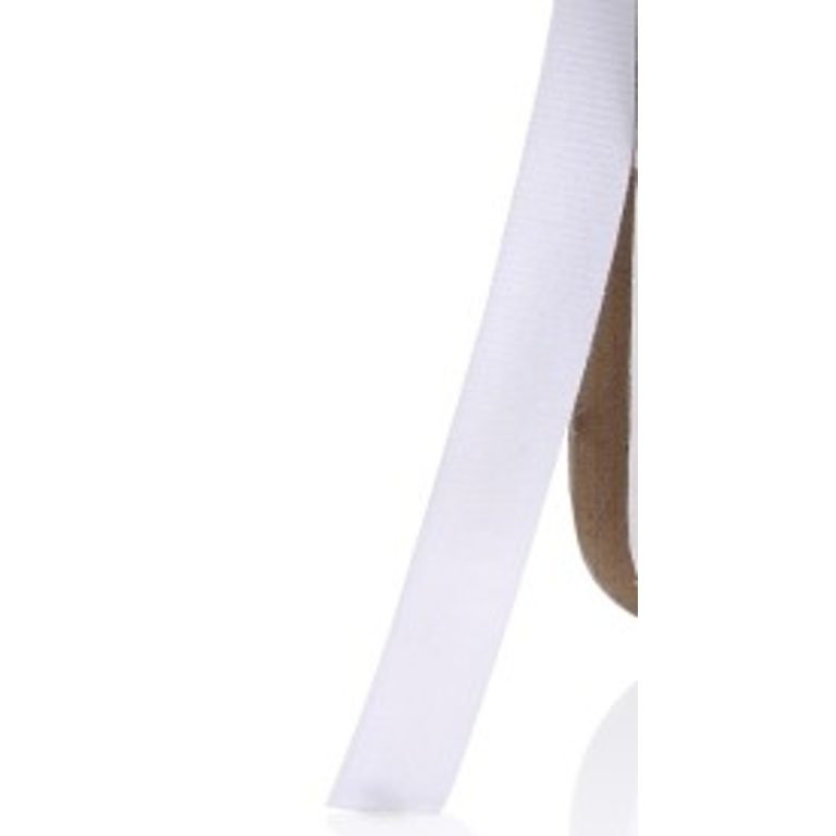 A close-up of a white VELCRO® Brand ONE-WRAP Roll (25 yard) and a partial view of a brown curved object, both set against a white background.