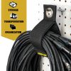 A Cord Lox® HangMaster™ ProSeries strap secures a coiled black cable on a pegboard The yellow panel lists features Storage Transportation Organizationideal for XLR cable storage with this heavy duty hook  loop hanging solution
