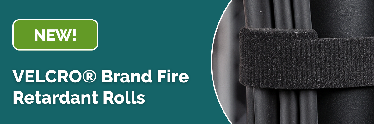 Close up of a black VELCRO® strap securing cables with text that reads NEW VELCRO® Brand Fire Retardant Rolls on a teal background