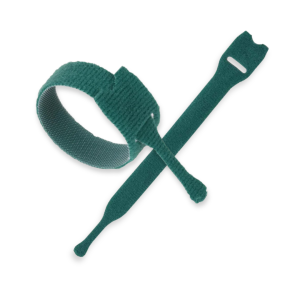 Two green VELCRO® Brand ONE-WRAP® cable ties, one coiled into a loop and the other lying flat and straight, both with rounded ends and a slit for fastening, displayed on a white background.