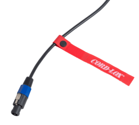 A black cable with a blue and black connector secured by a red Cord Lox strap is shown against a white background
